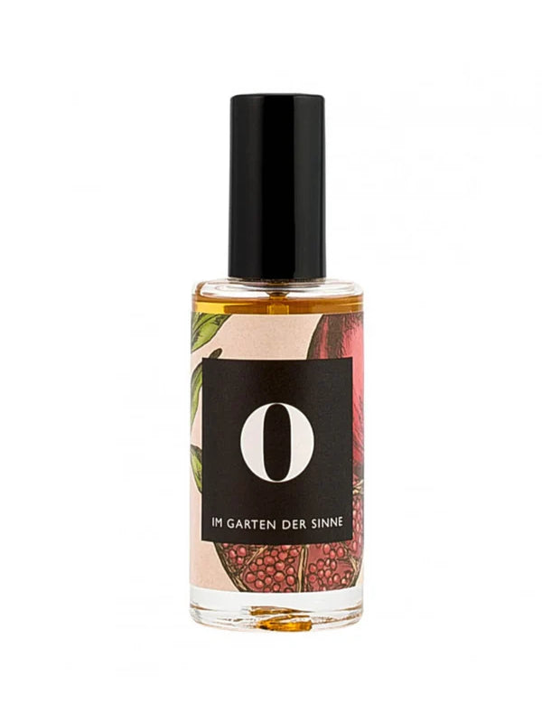 Parfümflasche mit botanischem Etikett &quot;Im Garten der Sinne&quot;.