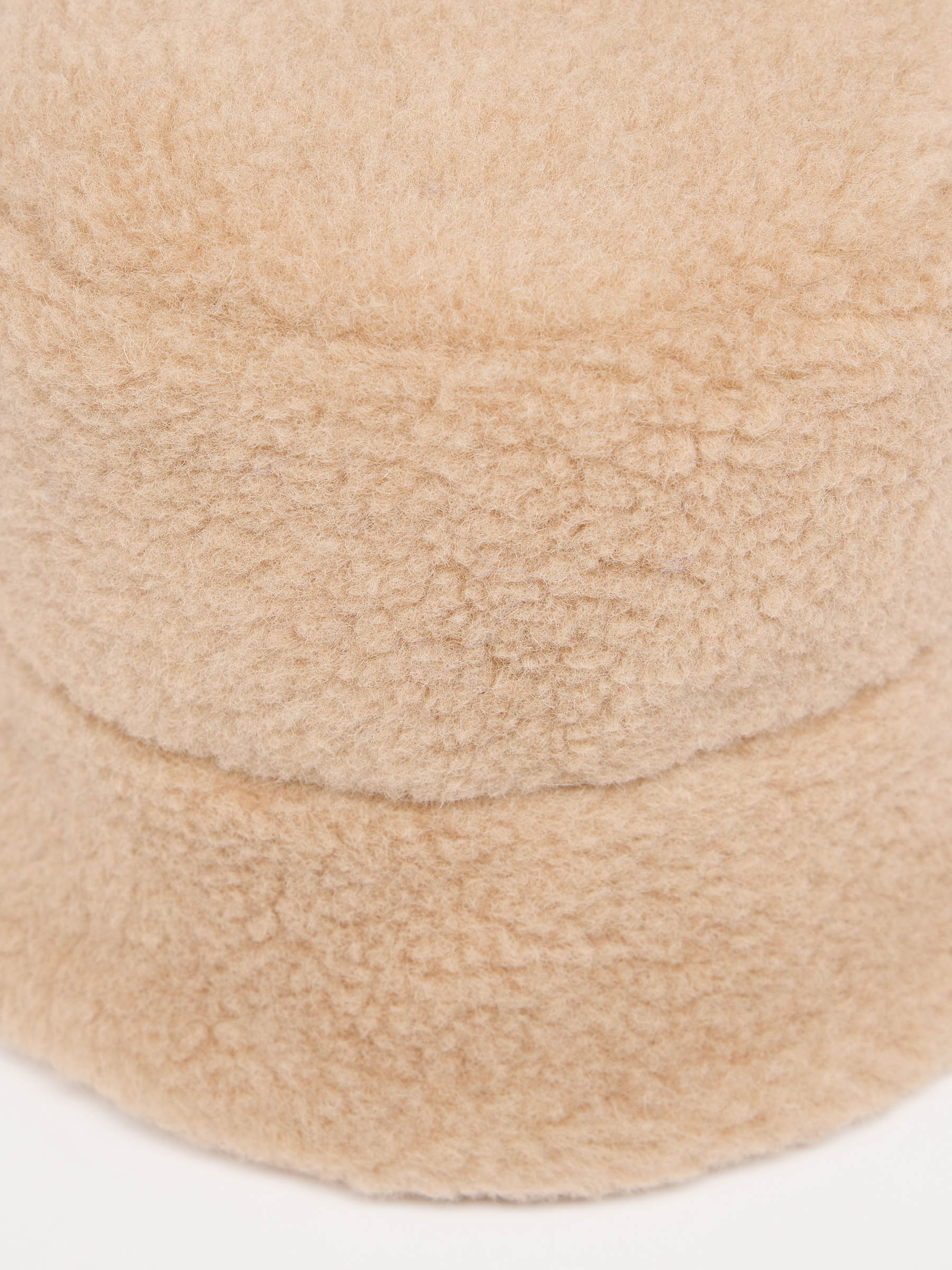 Nahaufnahme von beigem Flauschmaterial